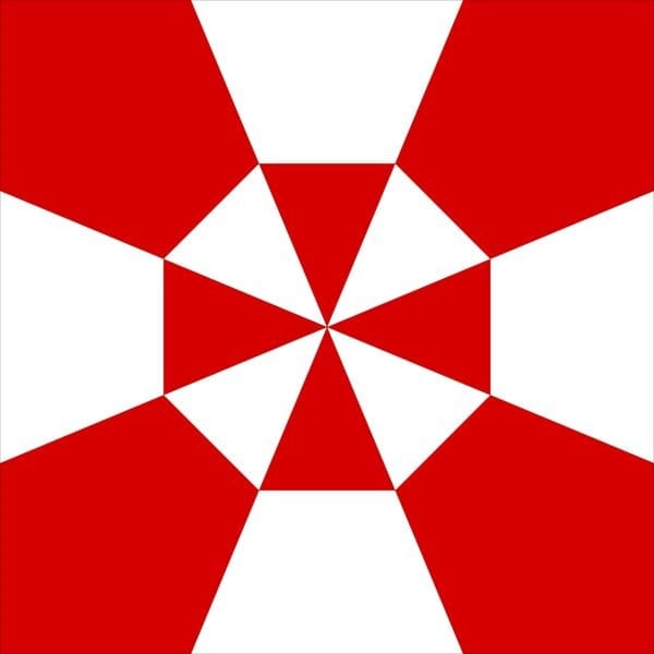 A red and white umbrella with an inverted triangle pattern.