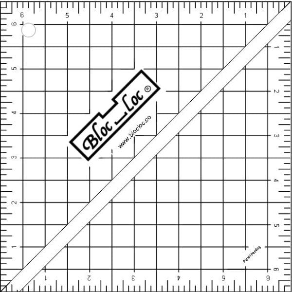 A ruler and some lines on top of a square.