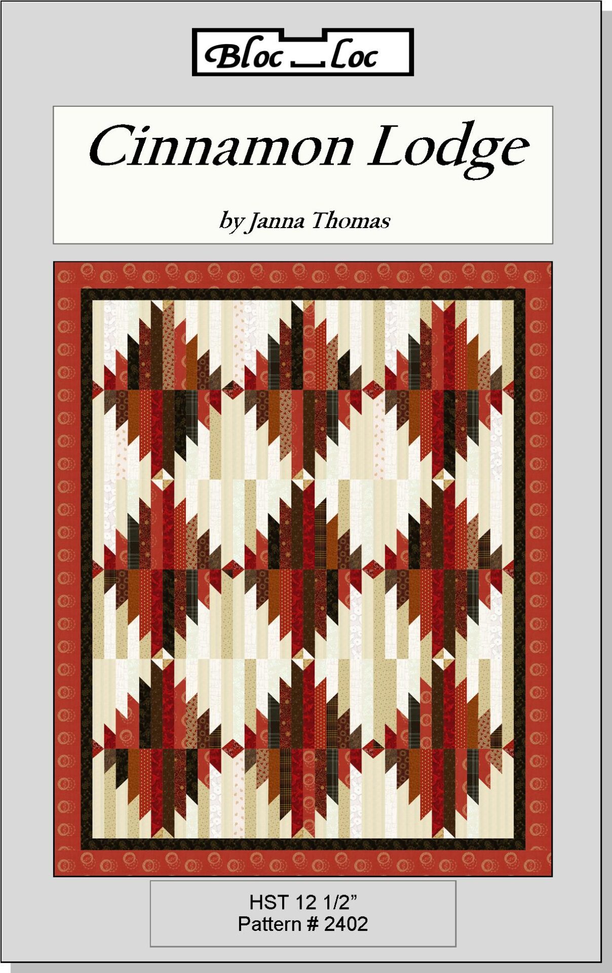 A quilt with red and white designs on it.