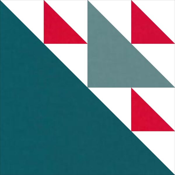 A green and red quilt block with white triangles.